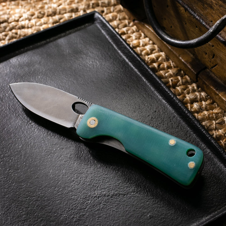 Roarcraft TR micarta saplı cep çakısı, dayanıklı tasarımı ve keskin bıçağı ile kullanışlı bir alet