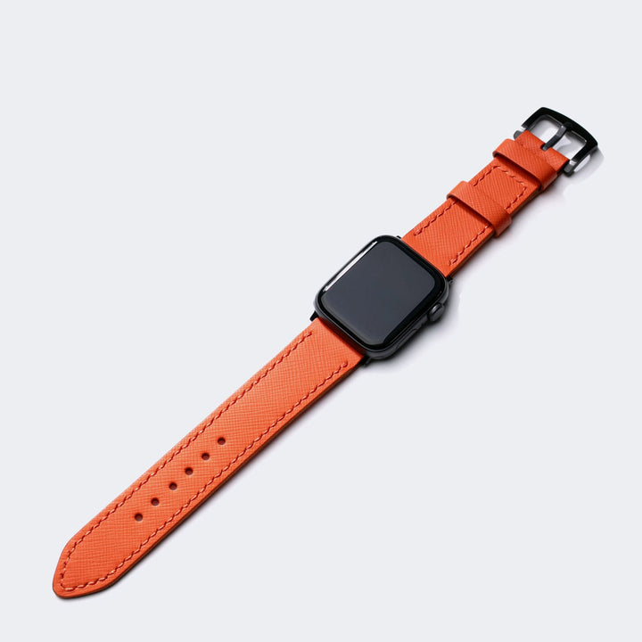 Saffiano turuncu deri Apple Watch kayış, şık tasarım ve konforlu kullanım sunuyor.